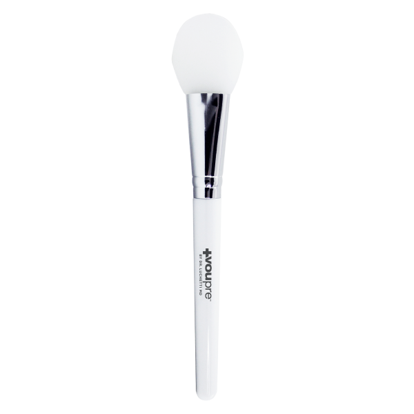 Professional white facial brush with a soft tip for spa and beauty treatments.