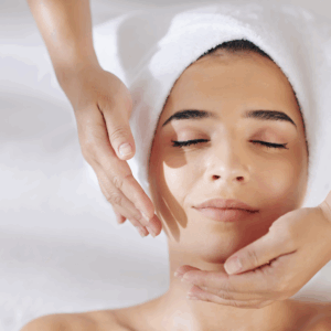Relaxing facial treatment at a spa, showcasing a serene woman enjoying skincare.