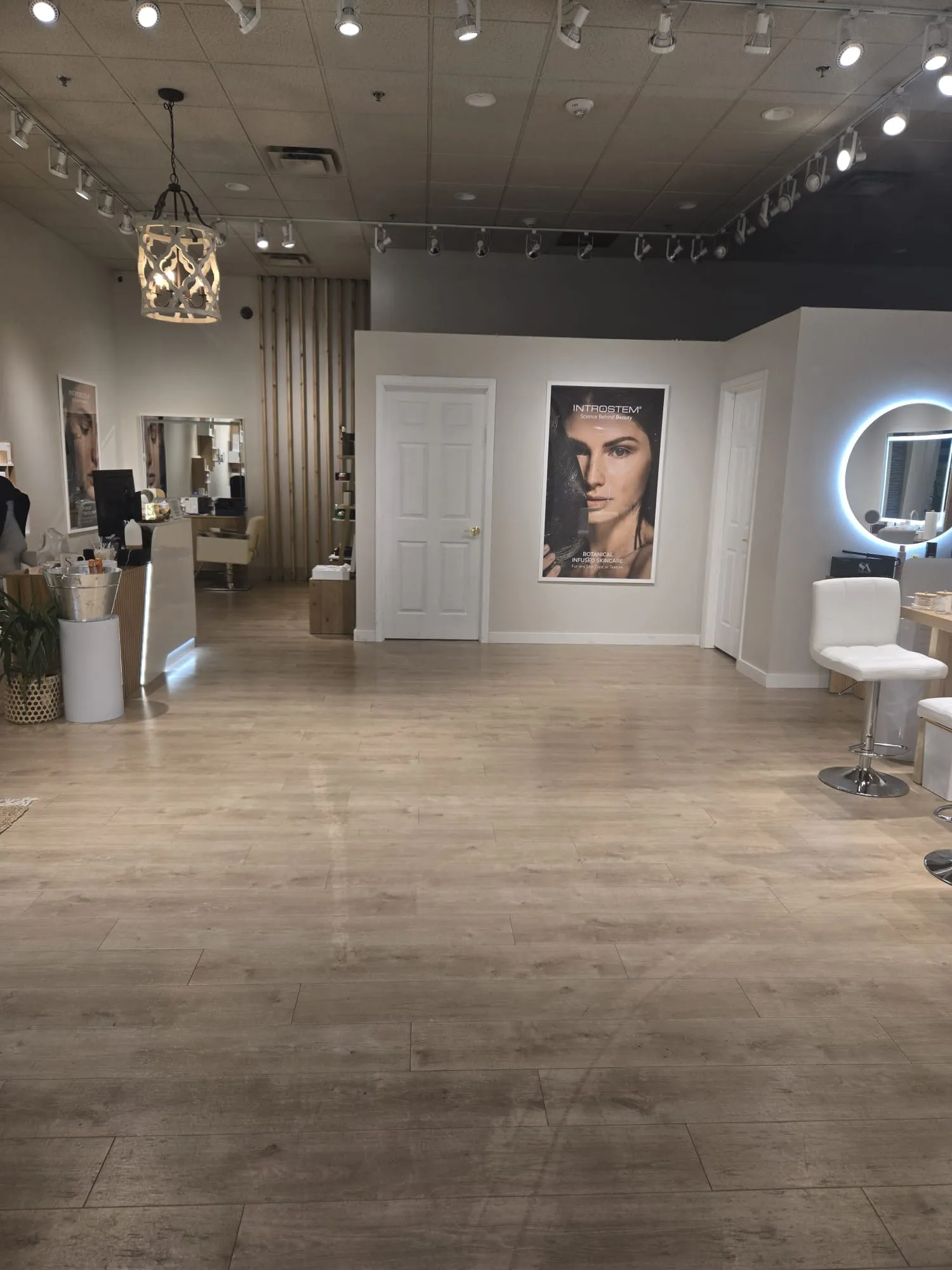 Spacious interior of Ora Sempre Spa with modern decor, treatment rooms, and reception area.