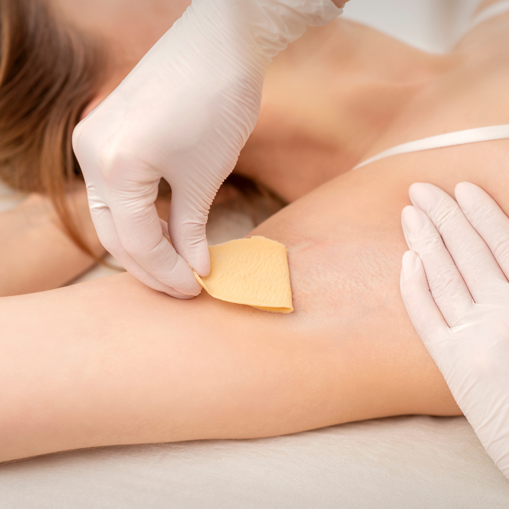 Hair waxing treatment session.